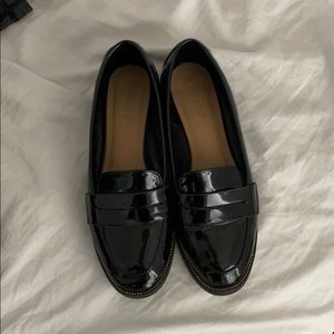 Glossy black loafers
